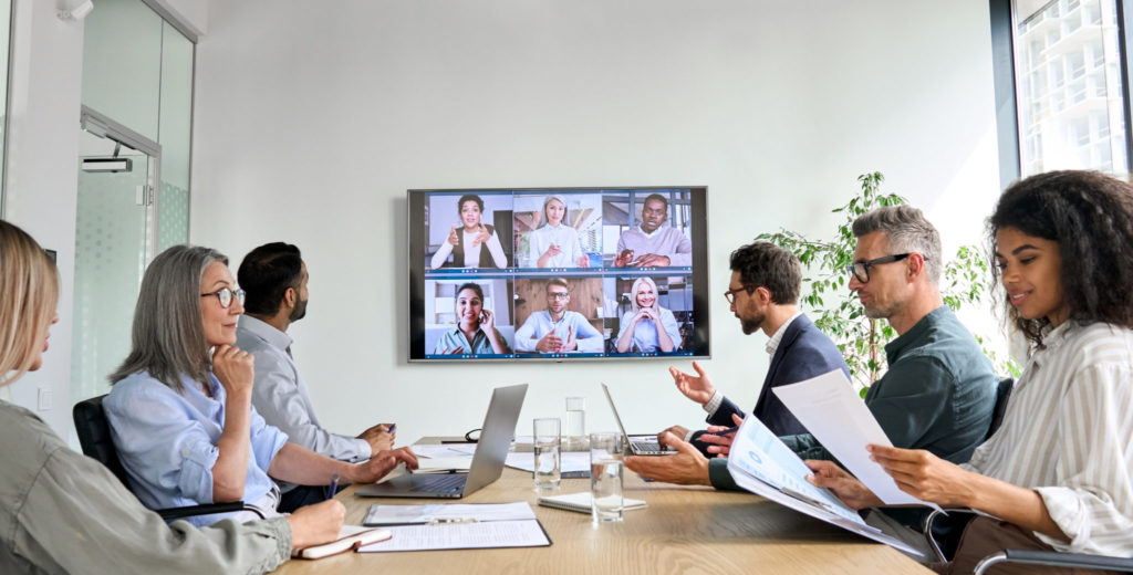Employees watching a secure internal video stream for corporate communication