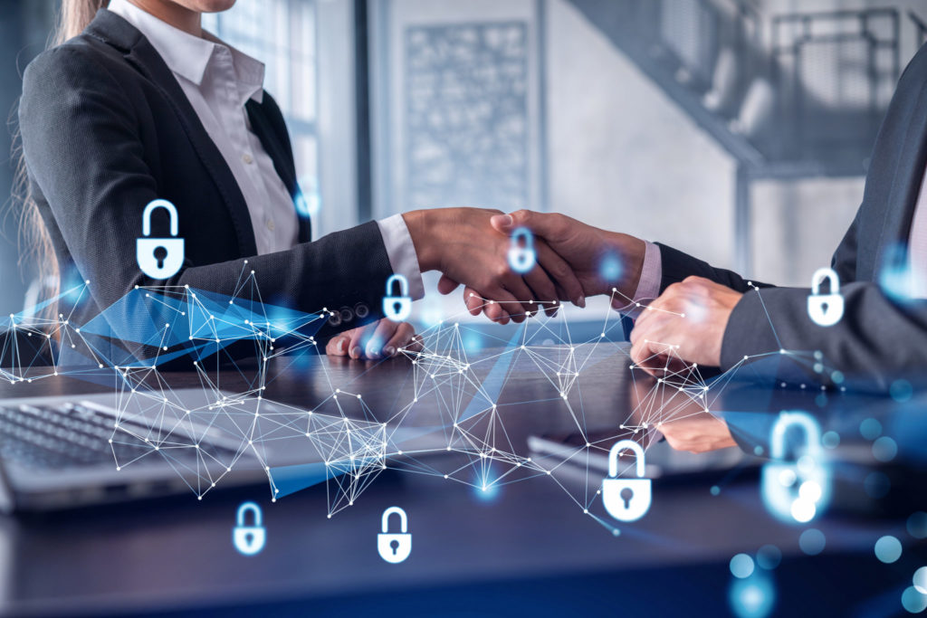 Business colleagues shaking hands with security icons overlay, representing secure corporate communication and protected internal video streaming.
